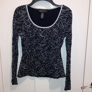 Petite black scoop neck top. Fabric design. INC.